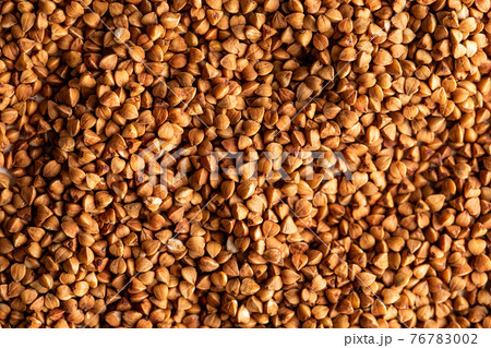 Buckwheat background, texture, the rump. Roasted buckwheat. Useful properties of buckwheat. Garnish. Buckwheat background, texture, the rump. Roasted buckwheat. Useful properties of buckwheat. Garnish. 76783002