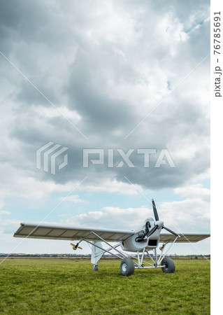 remote controlled agriculture spaying air plane in field at sunset, no people remote controlled agriculture spaying air plane in field at sunset, no people 76785691