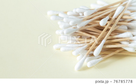 Bamboo cotton swabs or buds top view on beige background Bamboo cotton swabs or buds top view on beige background 76785778