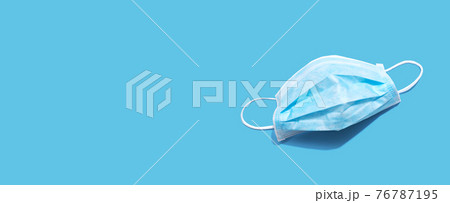 Blue surgical mask overhead view 76787195