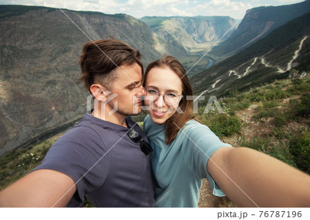 Loving couple together on mountain 76787196