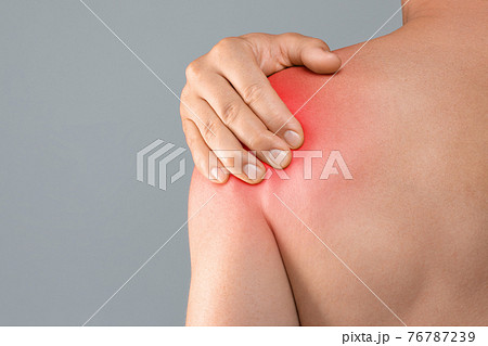 Closeup of topless man suffering from pain in shoulder 76787239