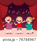 Children sing with a microphone on the stage 76788967