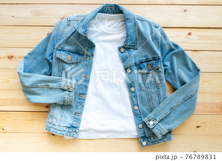 flat lay, White tshirt mockup and denim jacket jeans on brown wooden background. Template, 76789831