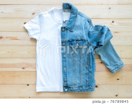 flat lay White tshirt mockup and denim jacket jeans on brown wooden background. Template, 76789845