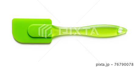 Green cooking silicone spatula isolated on white backgrounds. Green cooking silicone spatula isolated on white backgrounds. 76790078