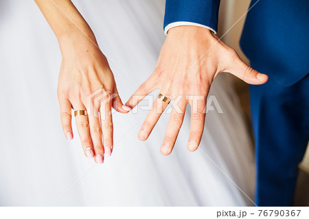 beautiful hands newlyweds display their wedding rings 76790367
