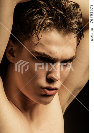 Muscle strong beautiful stripped male model in black jeans on black isolated font background 76793675