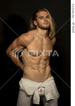 Sexy sport muscle strongface blond guy with long hair in white underwear on black isolated  font background 76794353