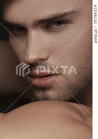 Sexy sport muscle strongface blond guy with long hair in white underwear on black isolated  font background 76794354
