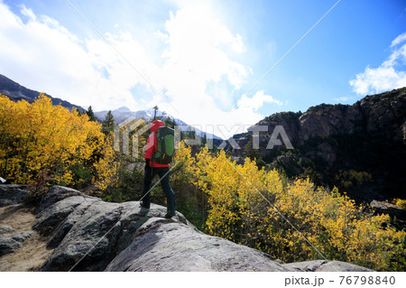 Backpacker hiking  in high altitude winter mountains 76798840