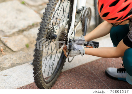 Successful woman looking at the view on high altitude mountain top 76801517