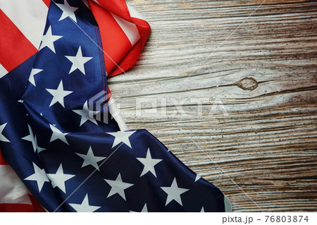 American USA Flag on wooden background 76803874