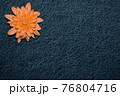 orange gerbera flower on denim texture background. blank design in the style of hippie, boho, bohemia for cards, invitations, flyers. free space for your text 76804716