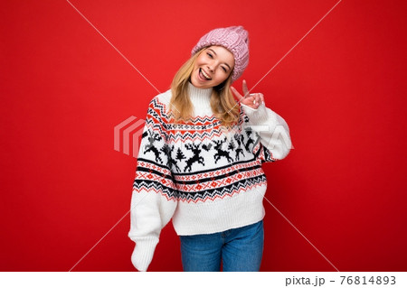 Photo of young positive happy beautiful blonde woman with sincere emotions wearing pink knitted hat Photo of young positive happy beautiful blonde woman with sincere emotions wearing pink knitted hat 76814893