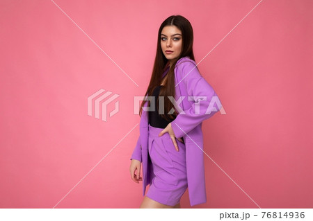 Young brunette woman nice-looking attractive charming elegant fashionable serious isolated over pink 76814936