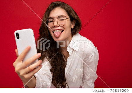 Closeup photo of sexy beautiful positive young brunette woman wearing white shirt and optical Closeup photo of sexy beautiful positive young brunette woman wearing white shirt and optical 76815000