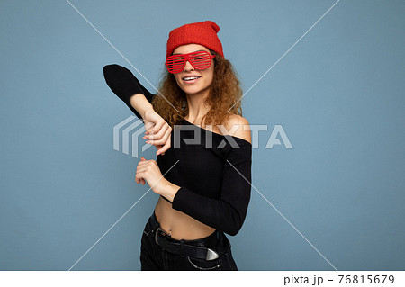 Photo shot of beautiful positive happy young dark blonde woman wearing casual clothes red bandana 76815679
