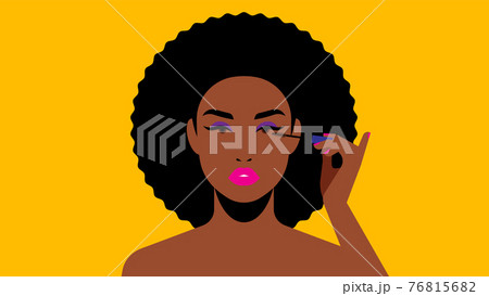 Beautiful black woman paints eyelashes. 76815682