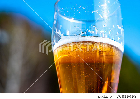 Light beer in a glass wine glass on a picnic on the nature Light beer in a glass wine glass on a picnic on the nature 76819498