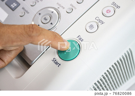 hand man are using a fax machine in the office, equipment for data transmission. hand man are using a fax machine in the office, equipment for data transmission. 76820086