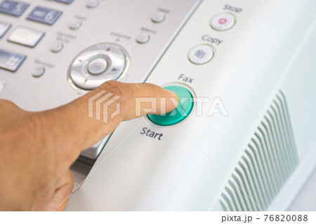 hand man are using a fax machine in the office, equipment for data transmission. 76820088