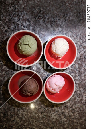 ice cream or green tea ice cream , strawberry ice cream and chocolate ice cream 76820735