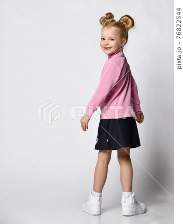 blonde with a stylish hairstyle in a pink 76822544