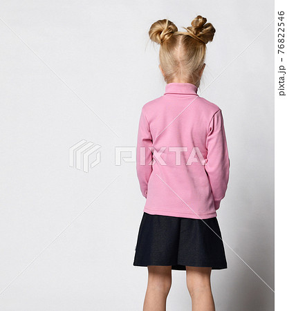blonde with a stylish hairstyle in a pink blonde with a stylish hairstyle in a pink 76822546