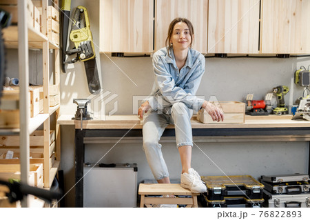 Handywoman in the home workshop 76822893