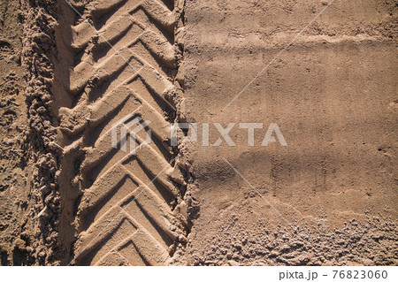sand with tractor wheel tread on it sand with tractor wheel tread on it 76823060