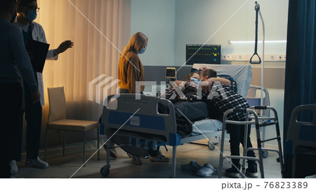 Doctor letting family to visit senior patient Doctor letting family to visit senior patient 76823389