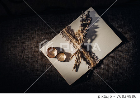 Close-up of two gold wedding rings for a wedding Close-up of two gold wedding rings for a wedding 76824986