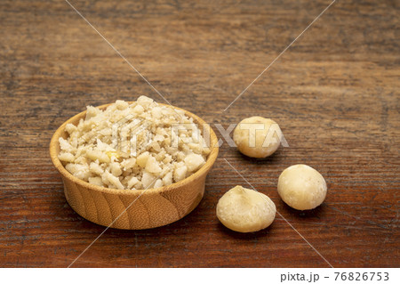 macadamia nut flour in wooden bowl macadamia nut flour in wooden bowl 76826753