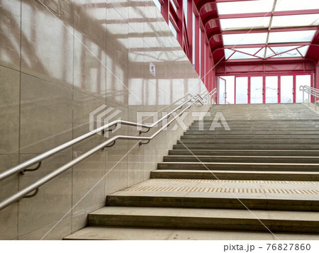 Modern descent to the pedestrian tunnel is empty without people. Stairway down to the underground new passage. Beige color Modern descent to the pedestrian tunnel is empty without people. Stairway down to the underground new passage. Beige color 76827860
