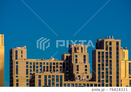 Panoramic view of unknown modern city buildings. 76828321