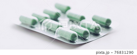 Green pills and capsules as nutrition supplement, wellness and healthcare Green pills and capsules as nutrition supplement, wellness and healthcare 76831290