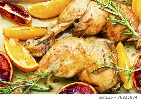 Chicken meat baked with oranges,close up 76835974