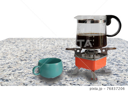 Coffee jar glass on top of camping stove on background. Coffee jar glass on top of camping stove on background. 76837206