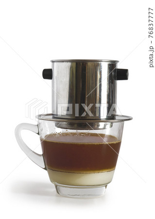 Sweetened condensed milk with hot coffee dripping in Vietnam style. 76837777