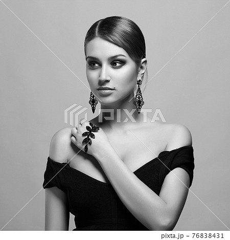 young woman with make-up and necklace young woman with make-up and necklace 76838431