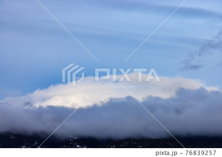 View of Puffy Clouds over the Canadian Mountain Landscape. 76839257