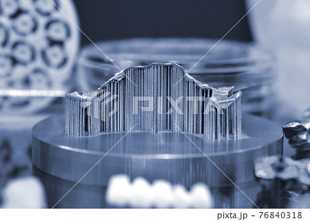 Object with supports created on a laser sintering machine on the work disk Object with supports created on a laser sintering machine on the work disk 76840318