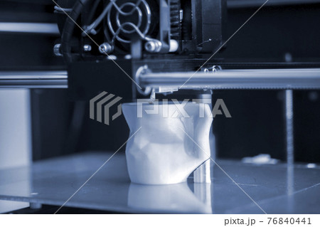 Objects printed by 3d printer. Automatic three dimensional 3d printer performs 76840441