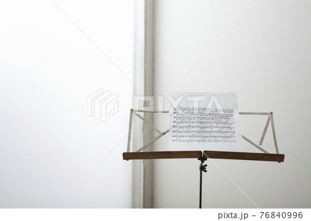 Closeup of a sheet music on music stand 76840996