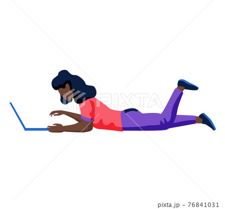 African woman freelancer, student at online learning works or studies at laptop lying on floor 76841031
