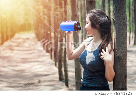 Sport beautiful young woman girl lifestyle exercise healthy drinking water after running  workout 76841328