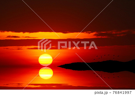 reflection sunset on the evening light cloud on the sky and silhouette birds flying 76841997