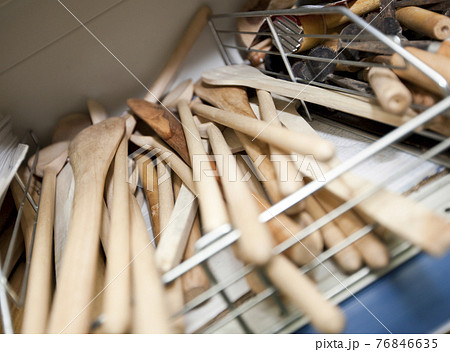 Wooden spatulas on shelf in utlensil store 76846635
