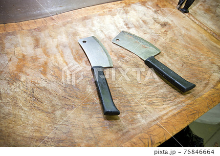 Butcher knife on cutting board in store Butcher knife on cutting board in store 76846664